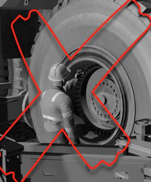 A rendered tyre fitter reaching into a wheel assembly, crossed out in red: the Crush Zone the Rim-Lock® and Rim-UnLock® systems take the person out of