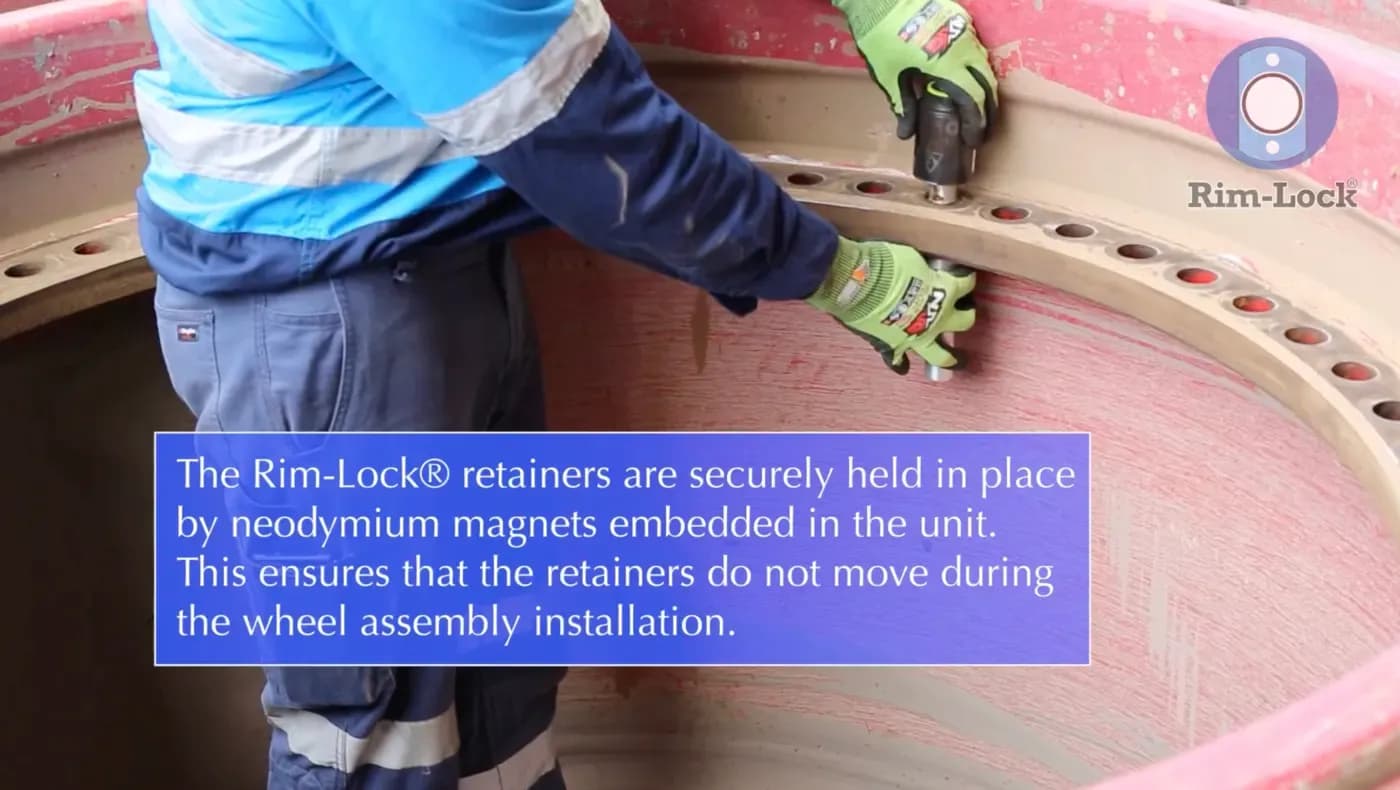 Neodymium magnets embedded in a Rim-Lock® retainer holding it to the nave plate