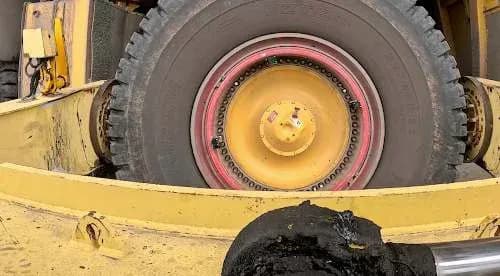 The tyre handler grasping the wheel assembly
